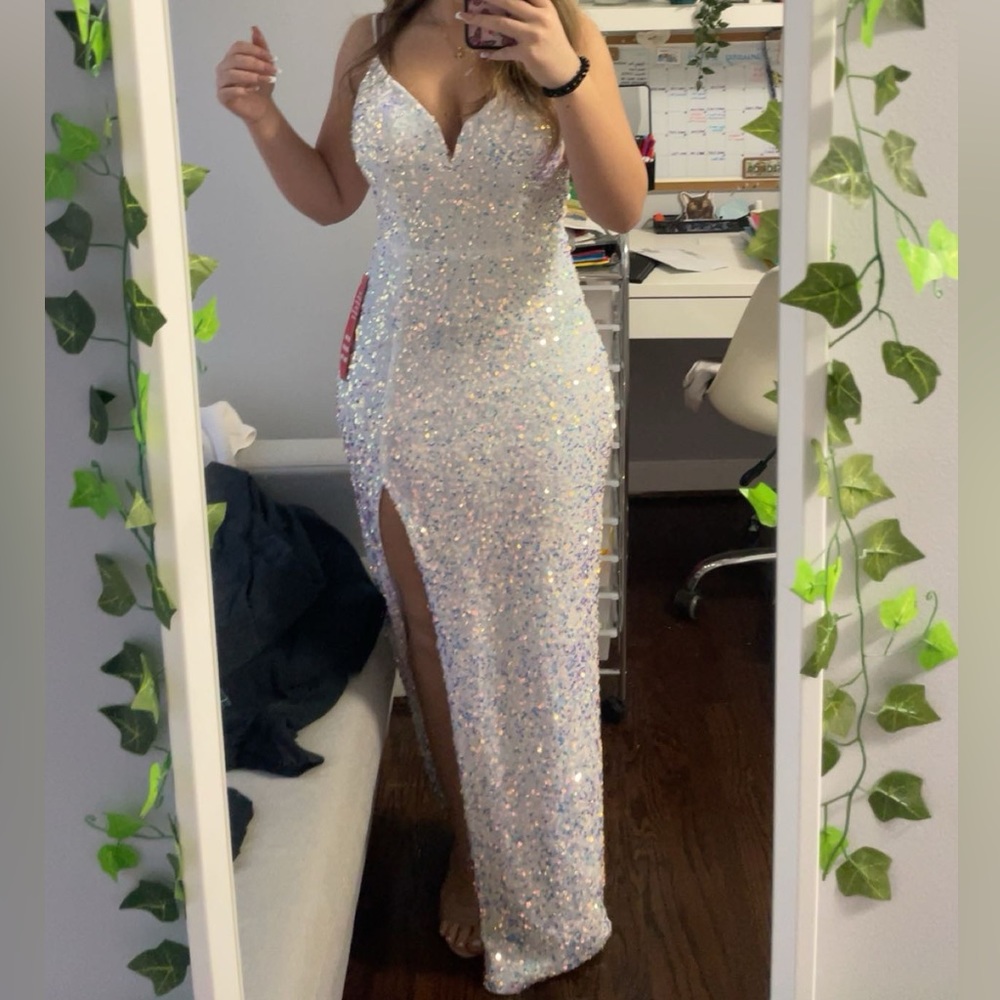White, iridescent prom dress. Has sequins and lining in the chest area.